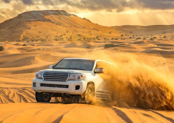 Desert safari dune-bashing scene
