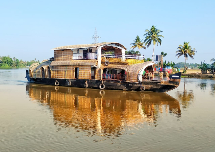 Backwater houseboat cruising through canals